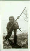 Marine with M1 by shoreline.jpg (62106 bytes)